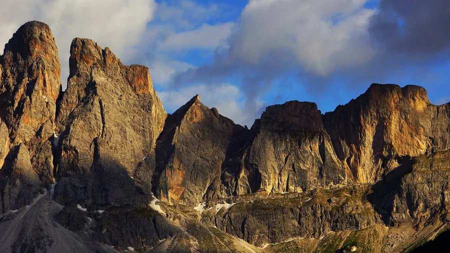 Sunlit mountain range captured with Canon RF 24–70mm lens