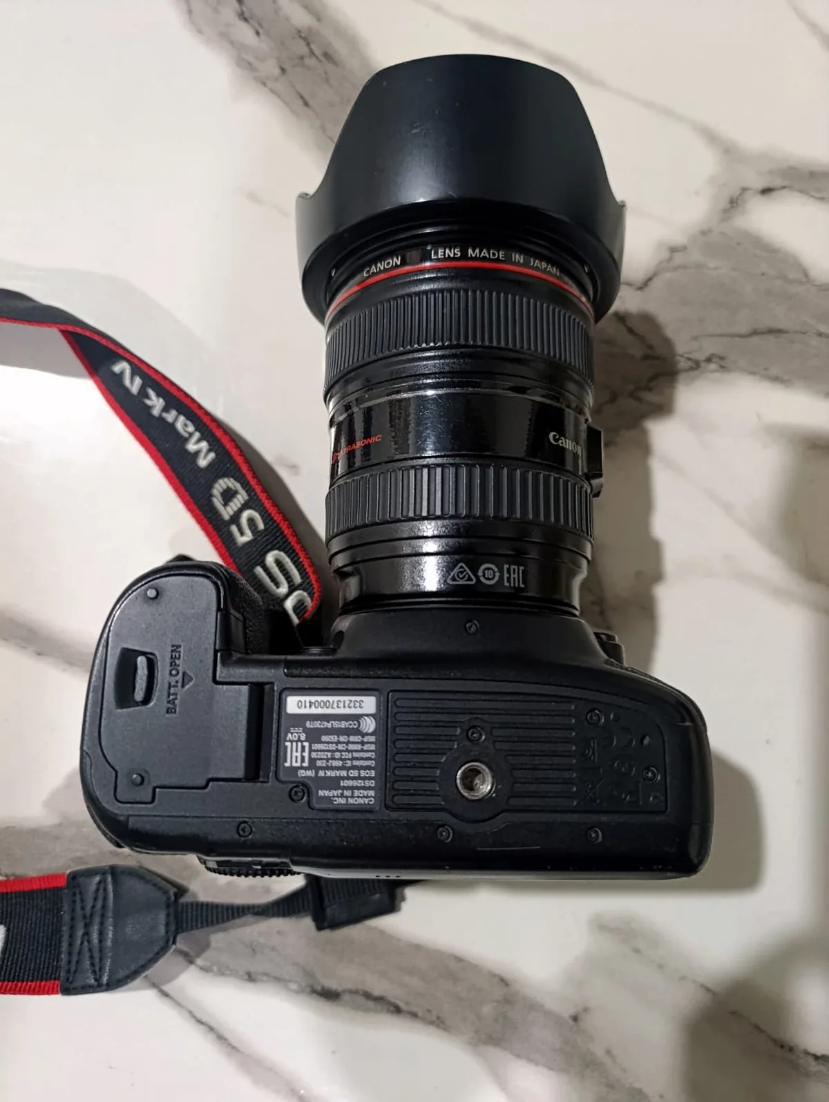 Baseplate of my Canon EOS 5D Mark IV showing the tripod mount and battery door