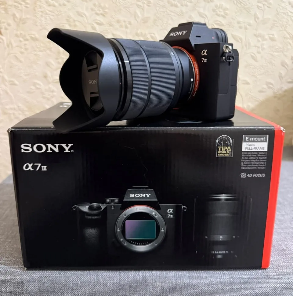 My Sony A7 III with the FE 28-70mm lens, sitting on its box